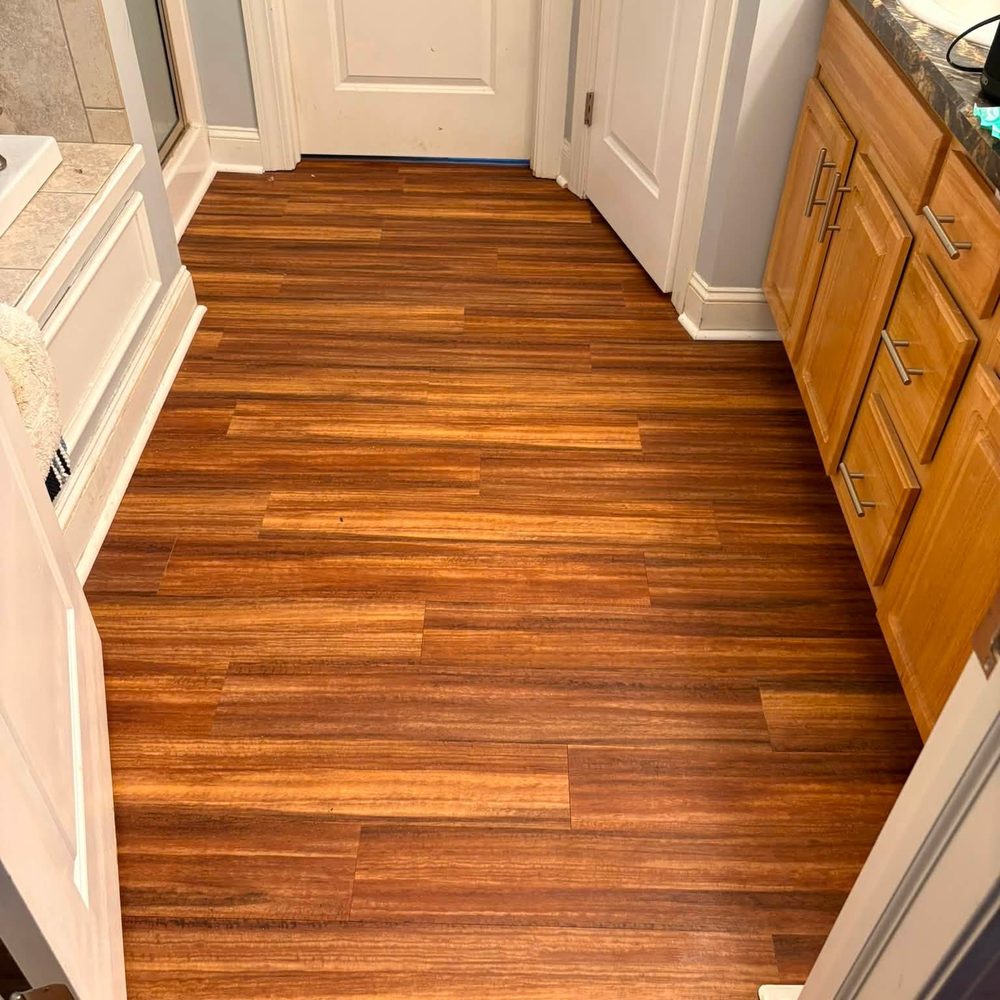 New luxury vinyl plank flooring installed in a Willoughby, Ohio bathroom