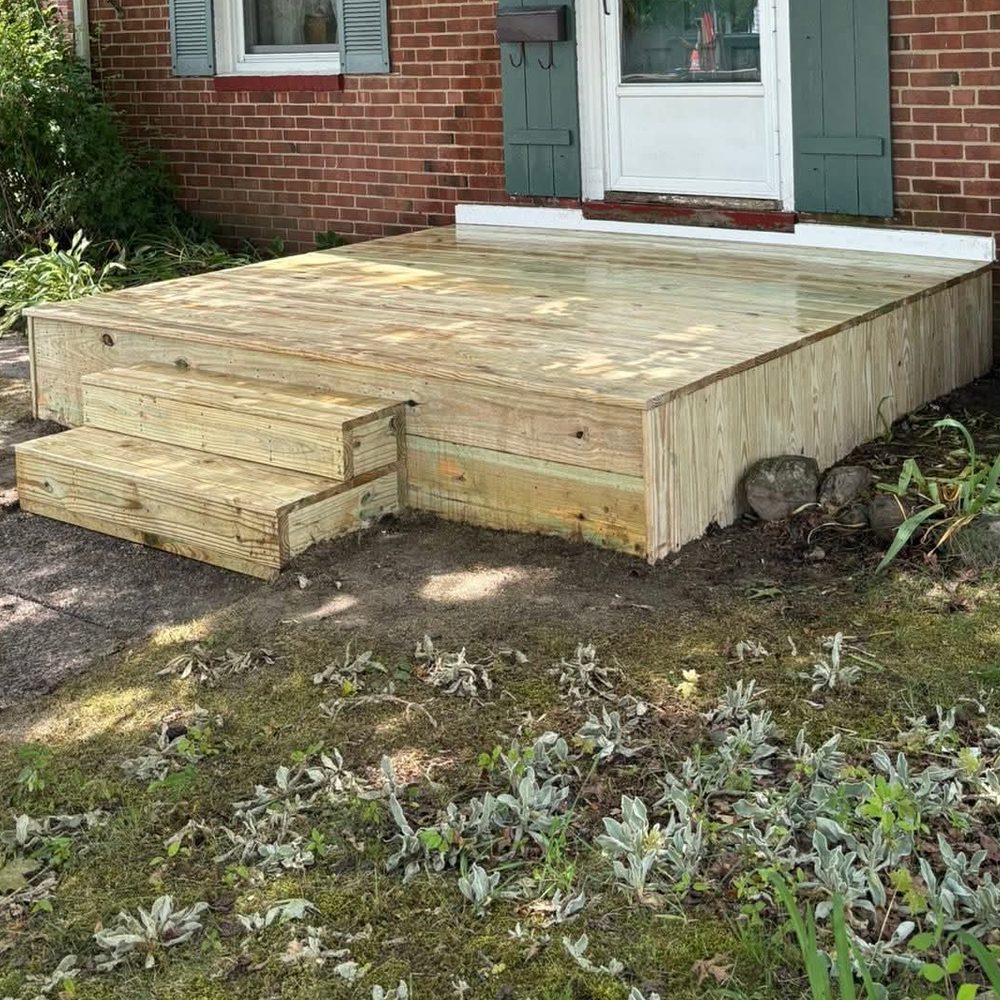 New pressure-treated front entry deck and steps at a Northeast Ohio brick home